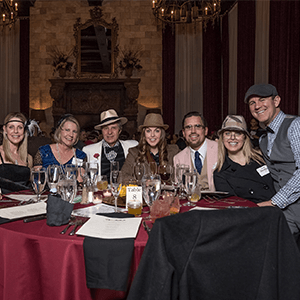 Columbus Murder Mystery party guests at the table